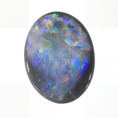 Oval-shaped opal stone with multicoloured play of light on a white background