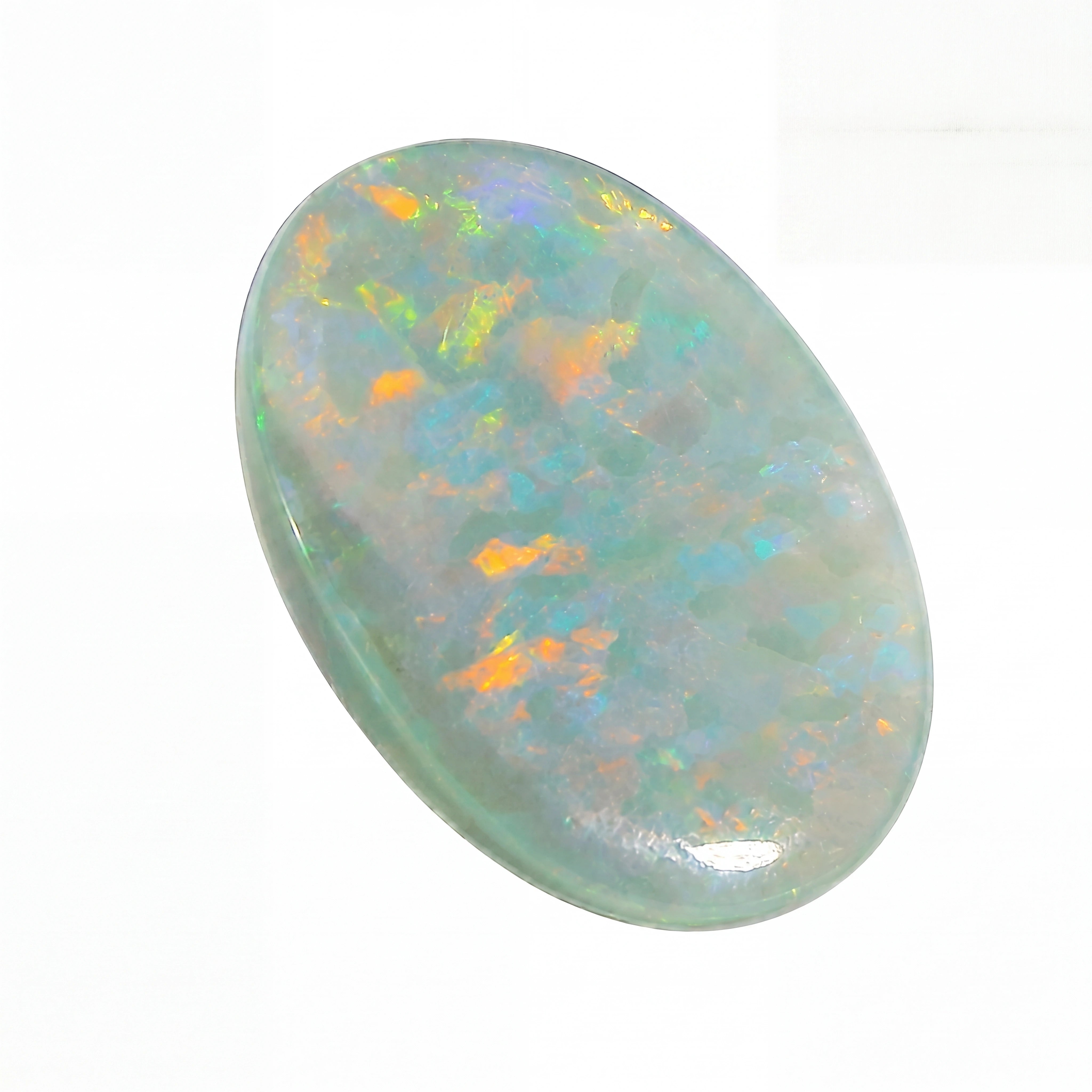 Opal stone with multicoloured play of light on a white background