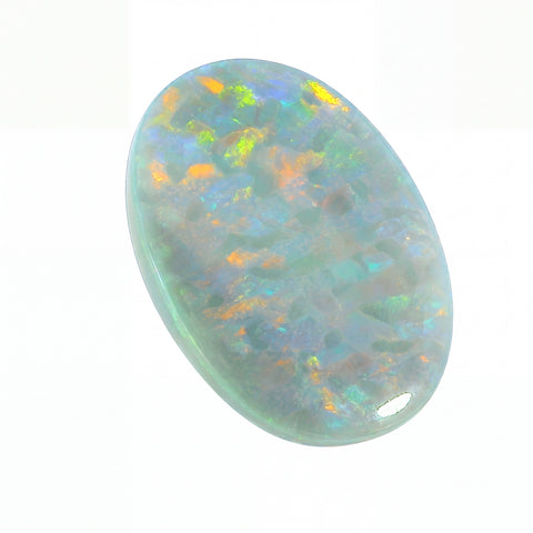 Oval-shaped opal stone with multicoloured play of light on a white background