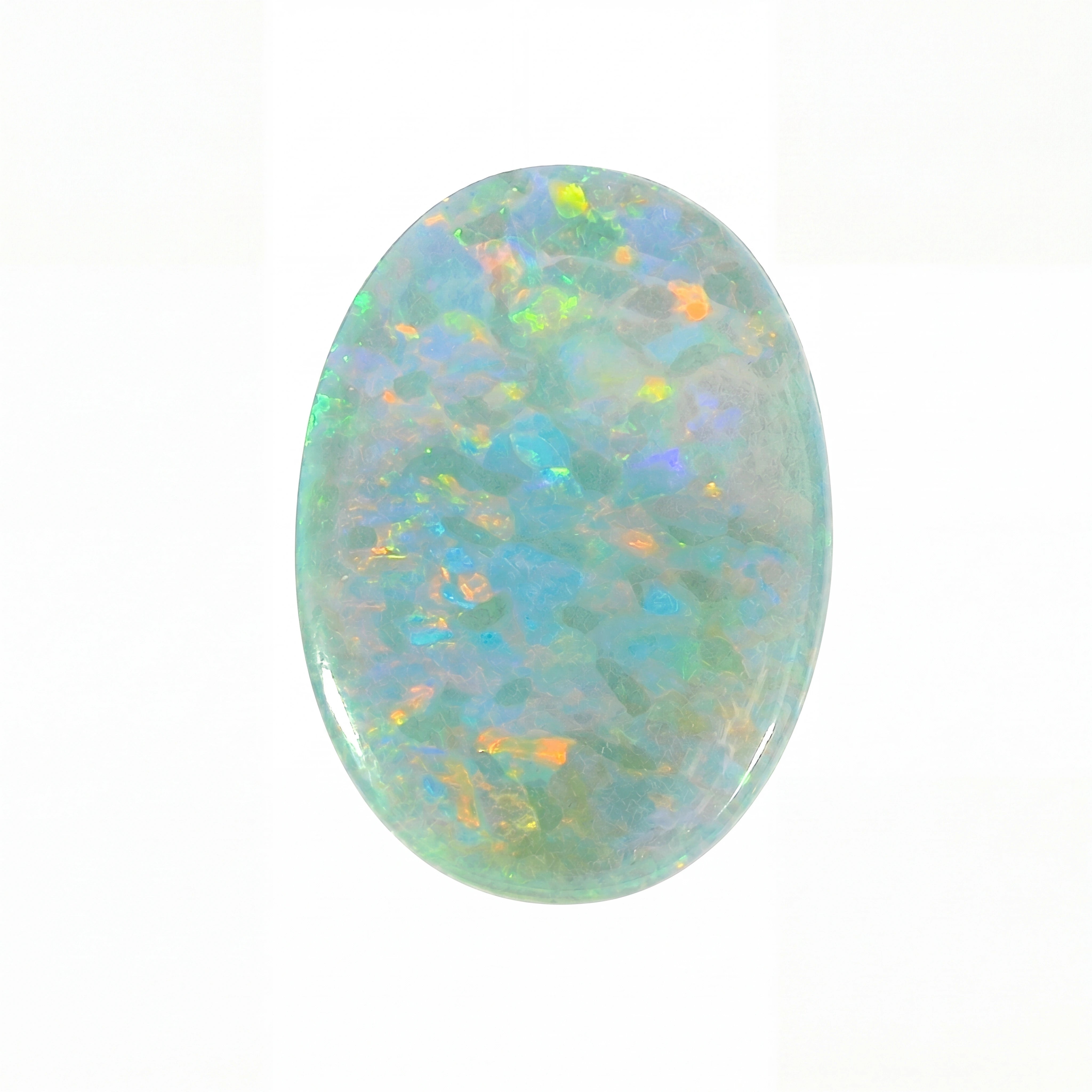 Oval-shaped opal stone with multicolour play of light on a white background