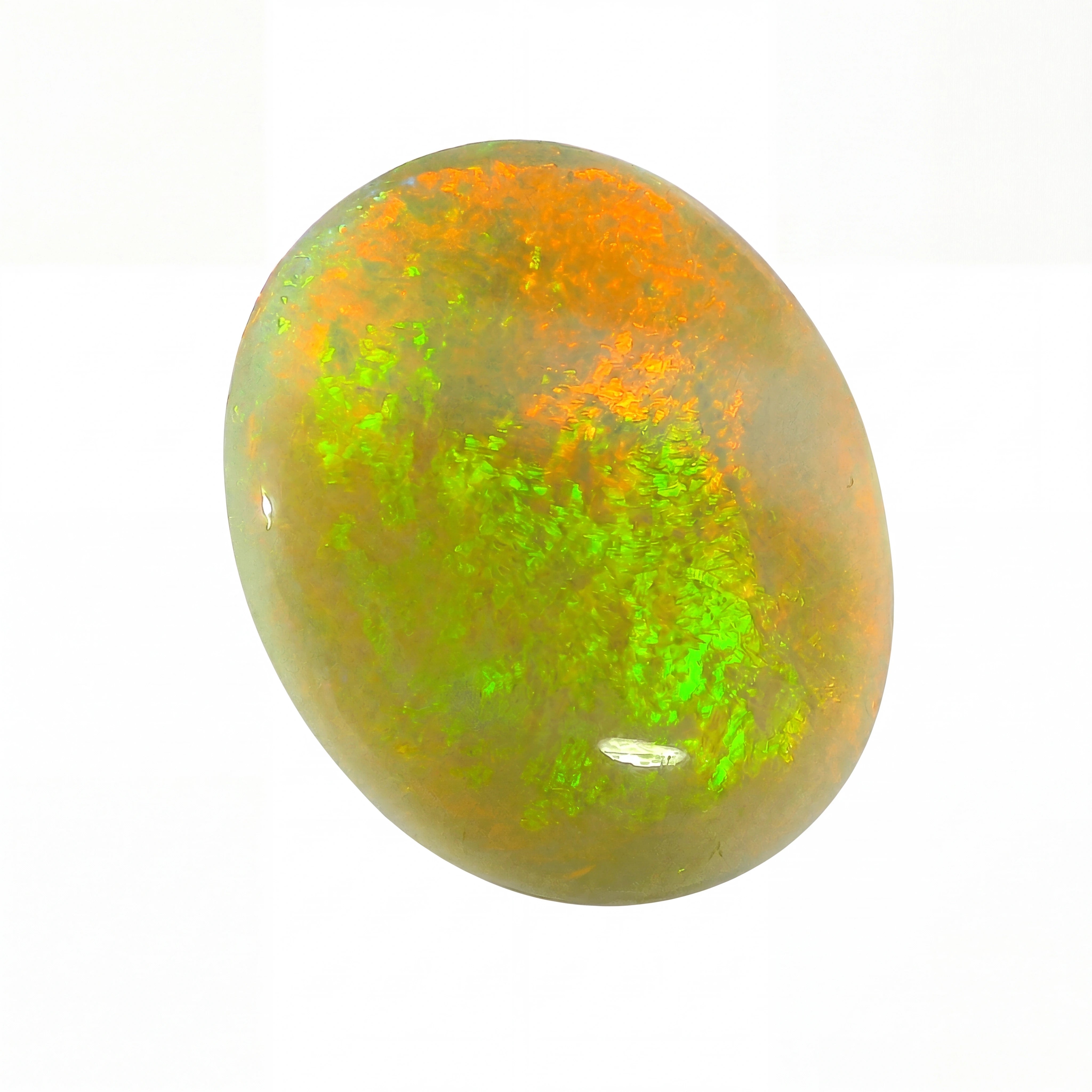 Opal stone with green and orange hues on a white background