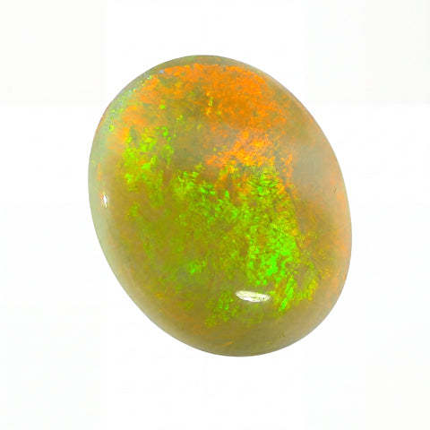 Opal stone with green and orange hues on a white background