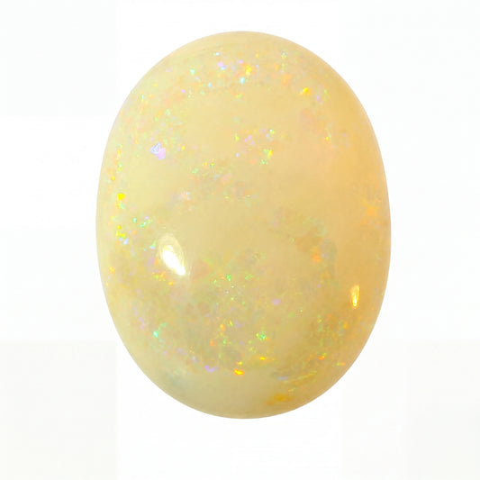 Yellow opal stone with a sparkly surface on a white background
