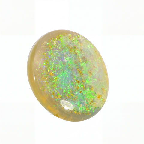 Opal stone with green and yellow fluorescence on a white background
