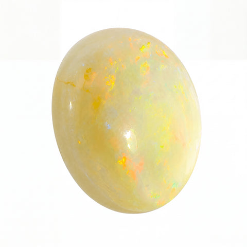 Opal stone with a yellowish hue on a white background