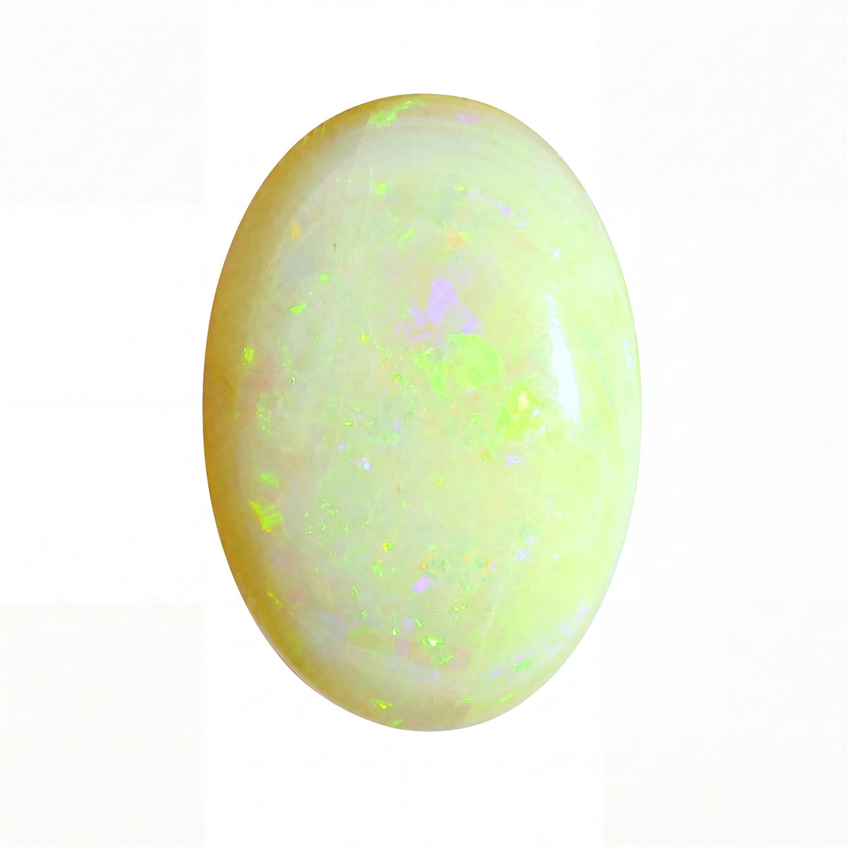 Opal stone with green and yellow fluorescence on a white background