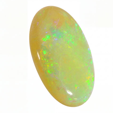 Opal stone with green and yellow fluorescence on a white background