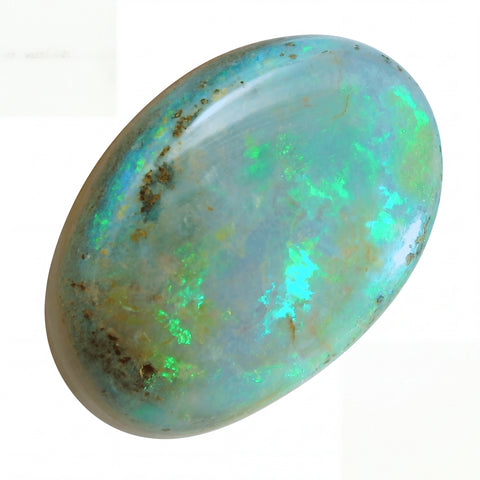 Opal stone with green and blue fluorescence on a white background
