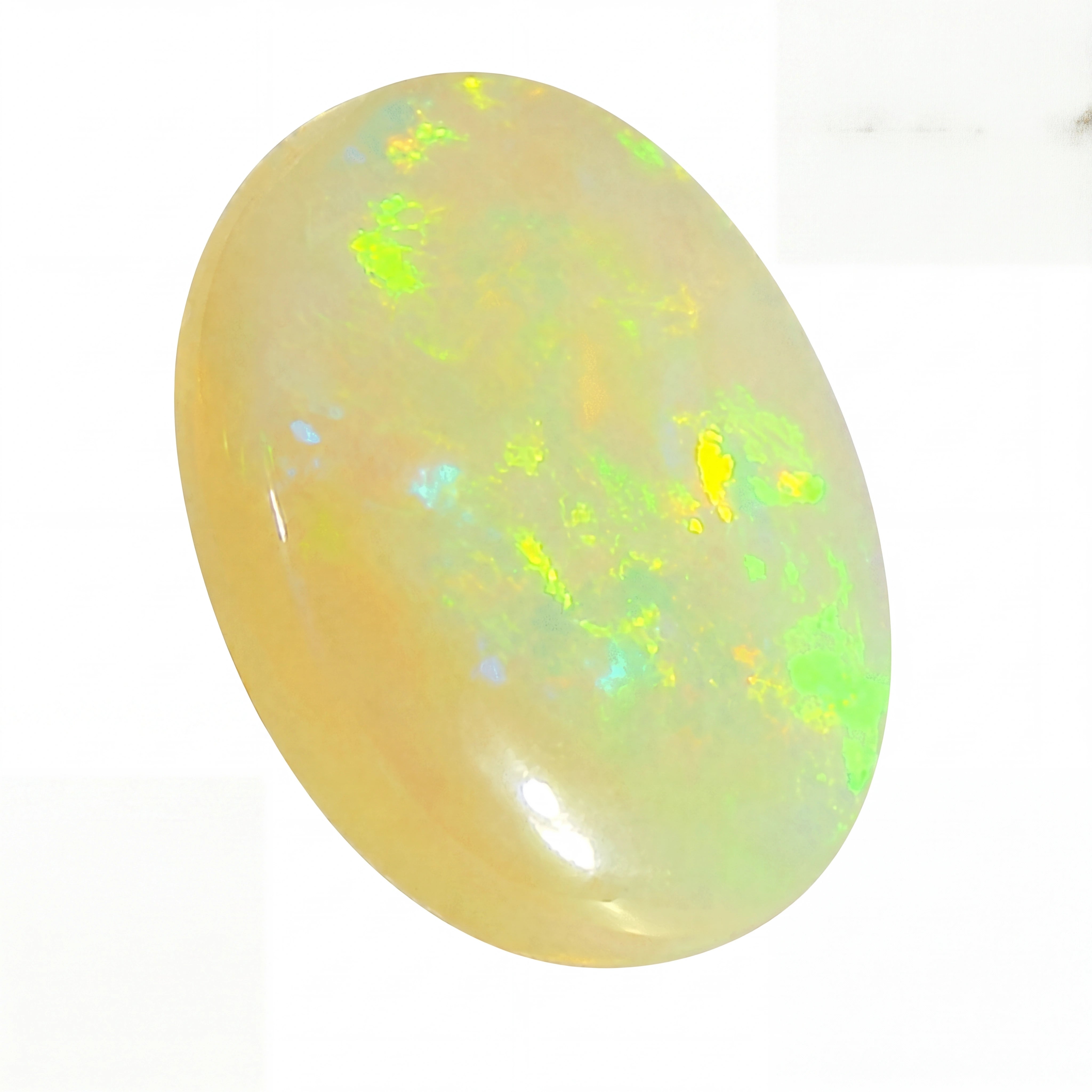 Opal stone with multicoloured fluorescence on a white background
