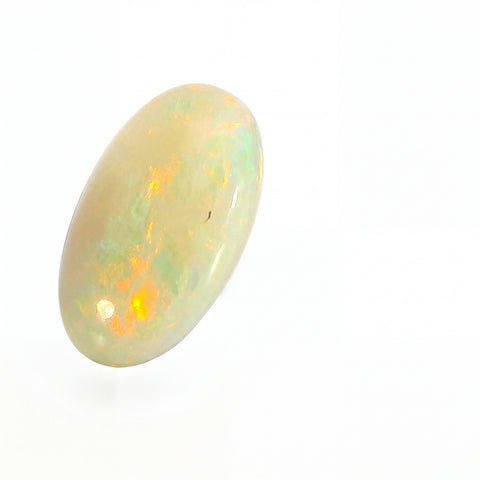 Opal stone with play of colours on a white background