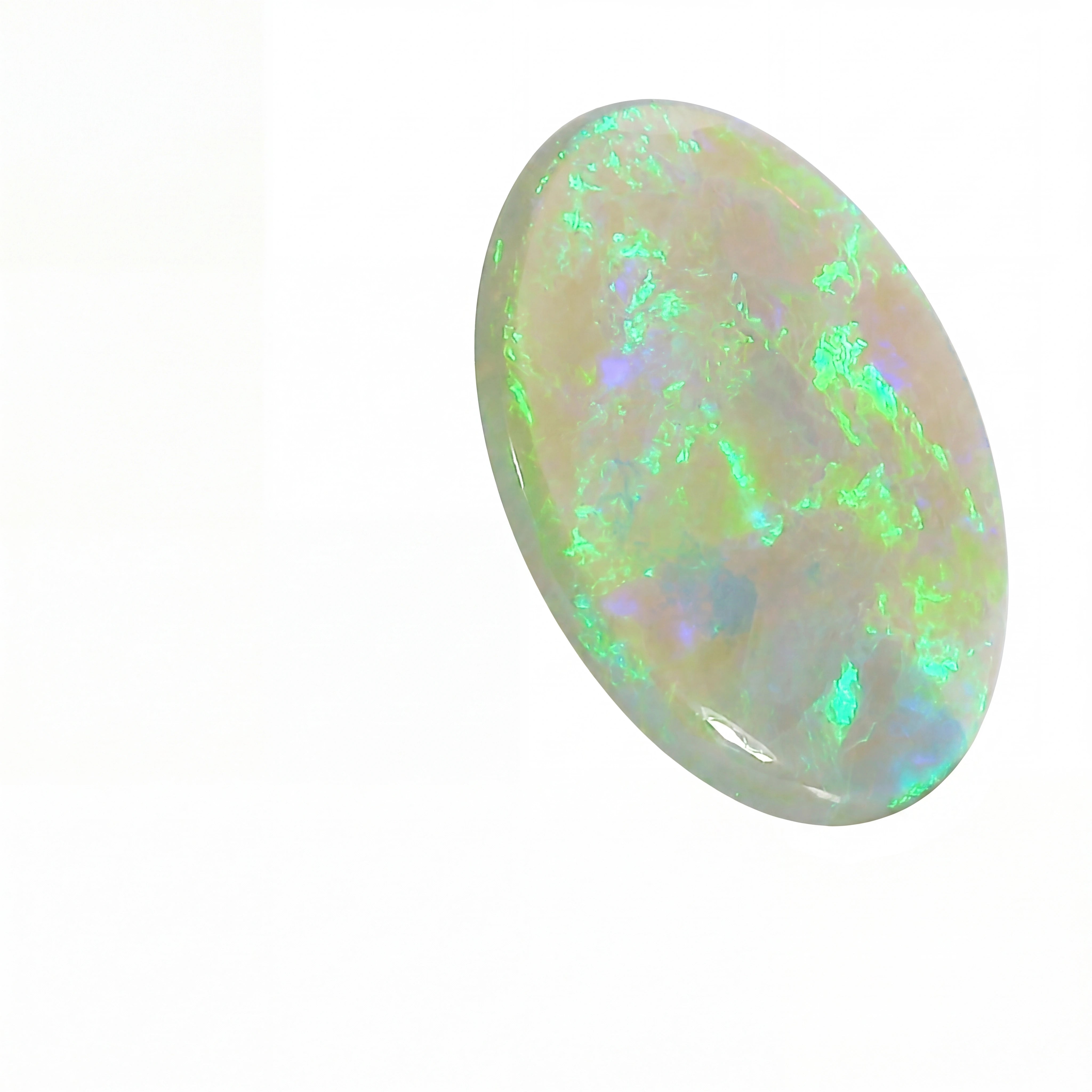 Opal stone with colourful play of light on a white background