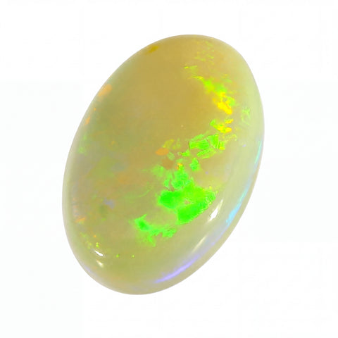 Opal stone with green fluorescence on a white background