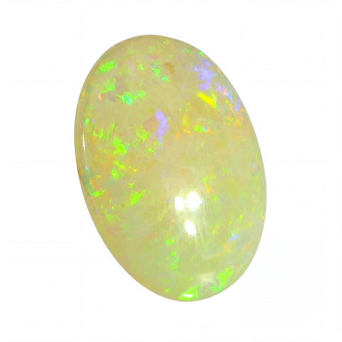 Opal stone with green and yellow fluorescence on a white background