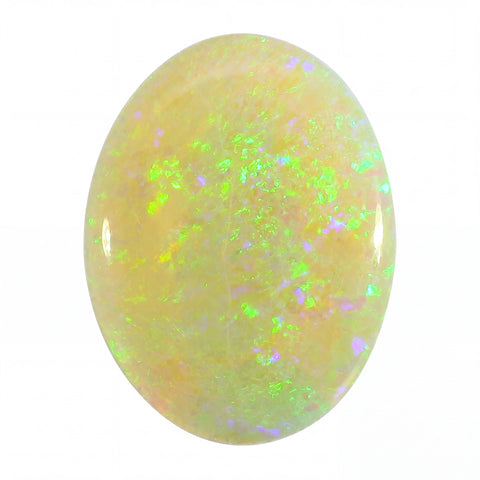 Opal stone with green and purple fluorescence on a white background
