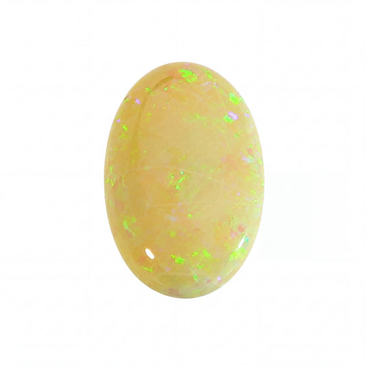 Oval-shaped opal stone with green and pink speckles on a white background