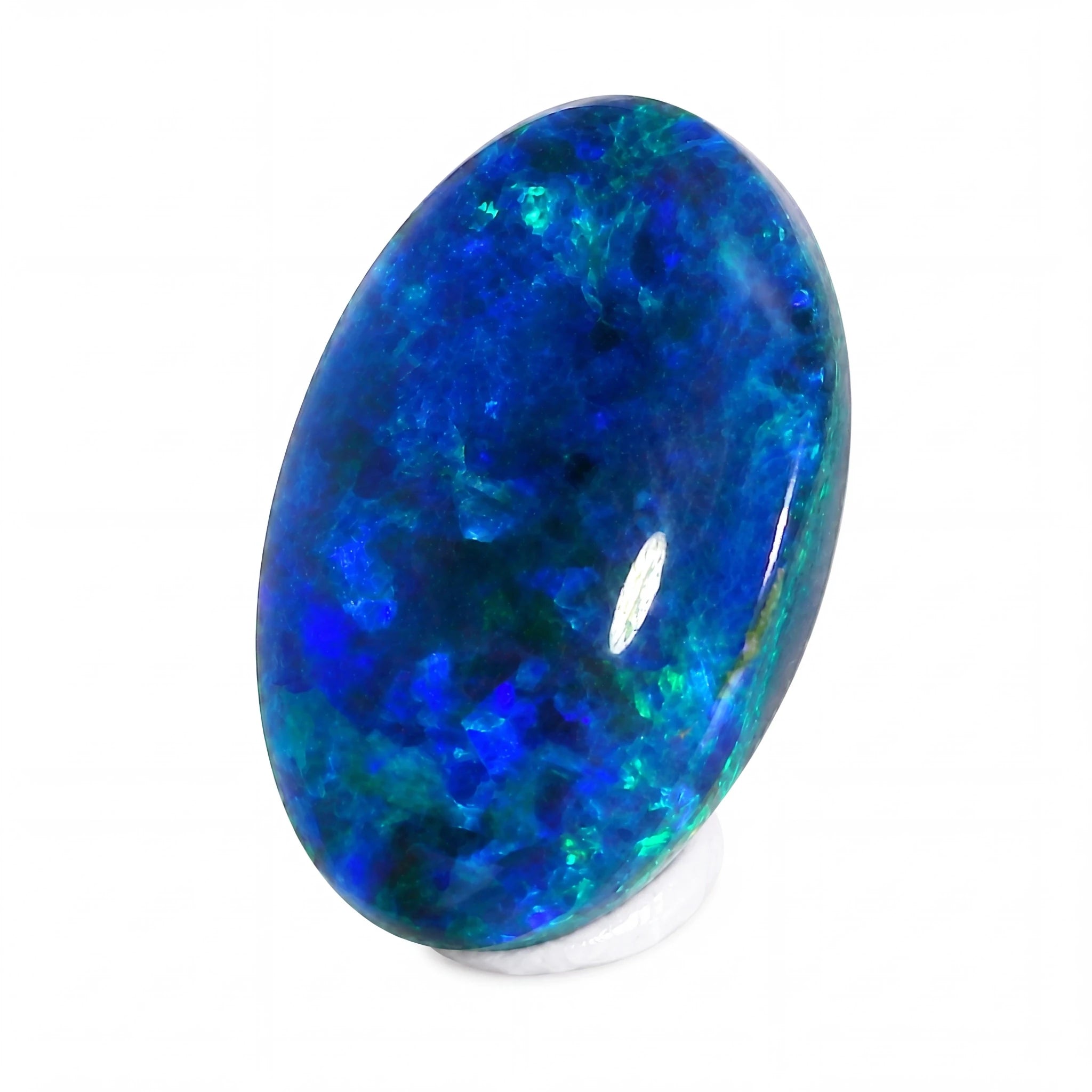 Oval-shaped blue opal gemstone on a white background