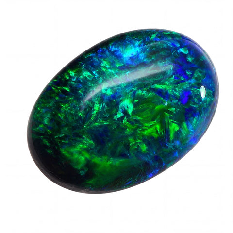 Oval-shaped gemstone with green and blue colours on a white background