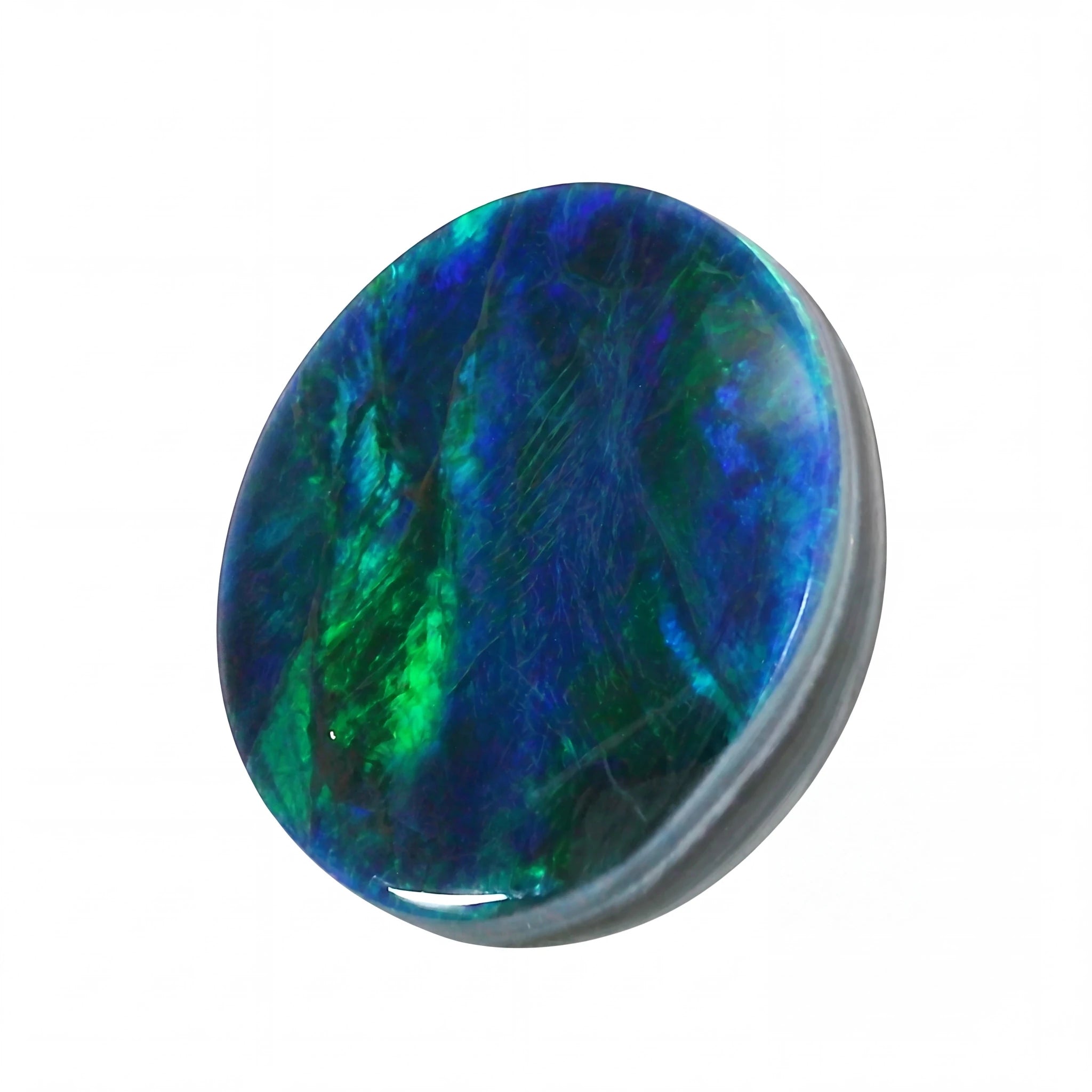Multicoloured stone with blue and green hues on a white background