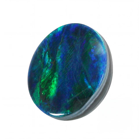 Multicoloured stone with blue and green hues on a white background