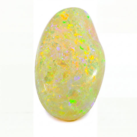 Opal stone with colourful speckles on a white background