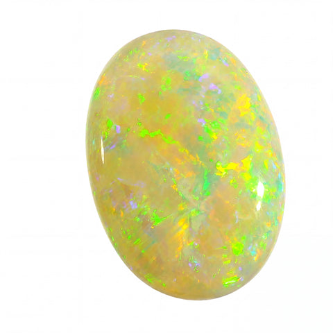 Opal stone with green and yellow speckles on a white background
