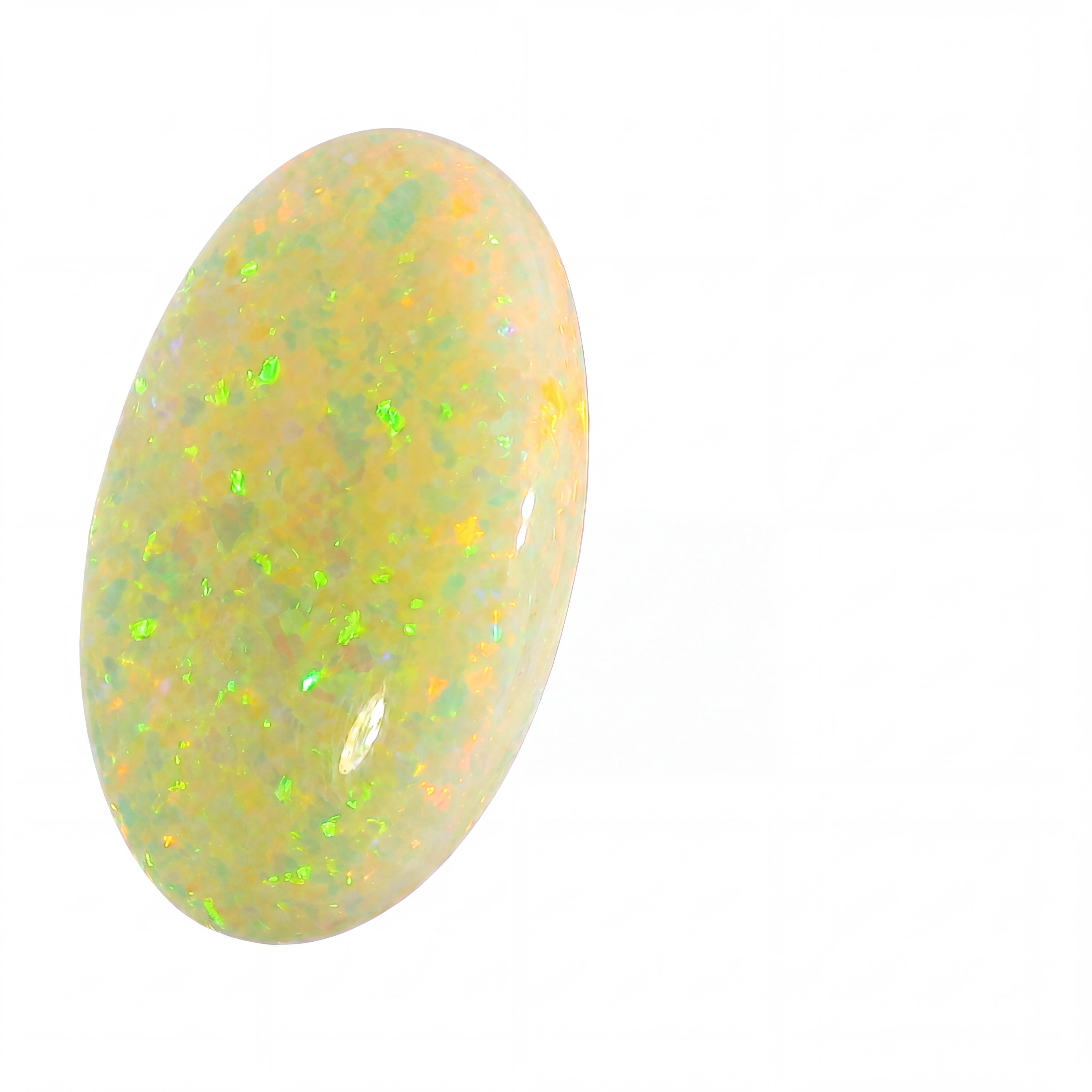 Opal stone with a yellowish hue and green flashes on a white background