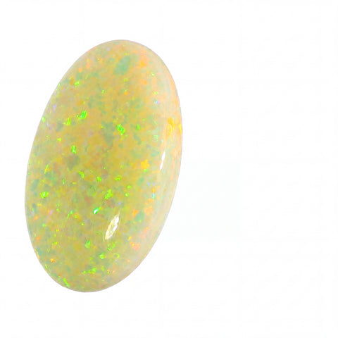 Opal stone with a yellowish hue and green flashes on a white background