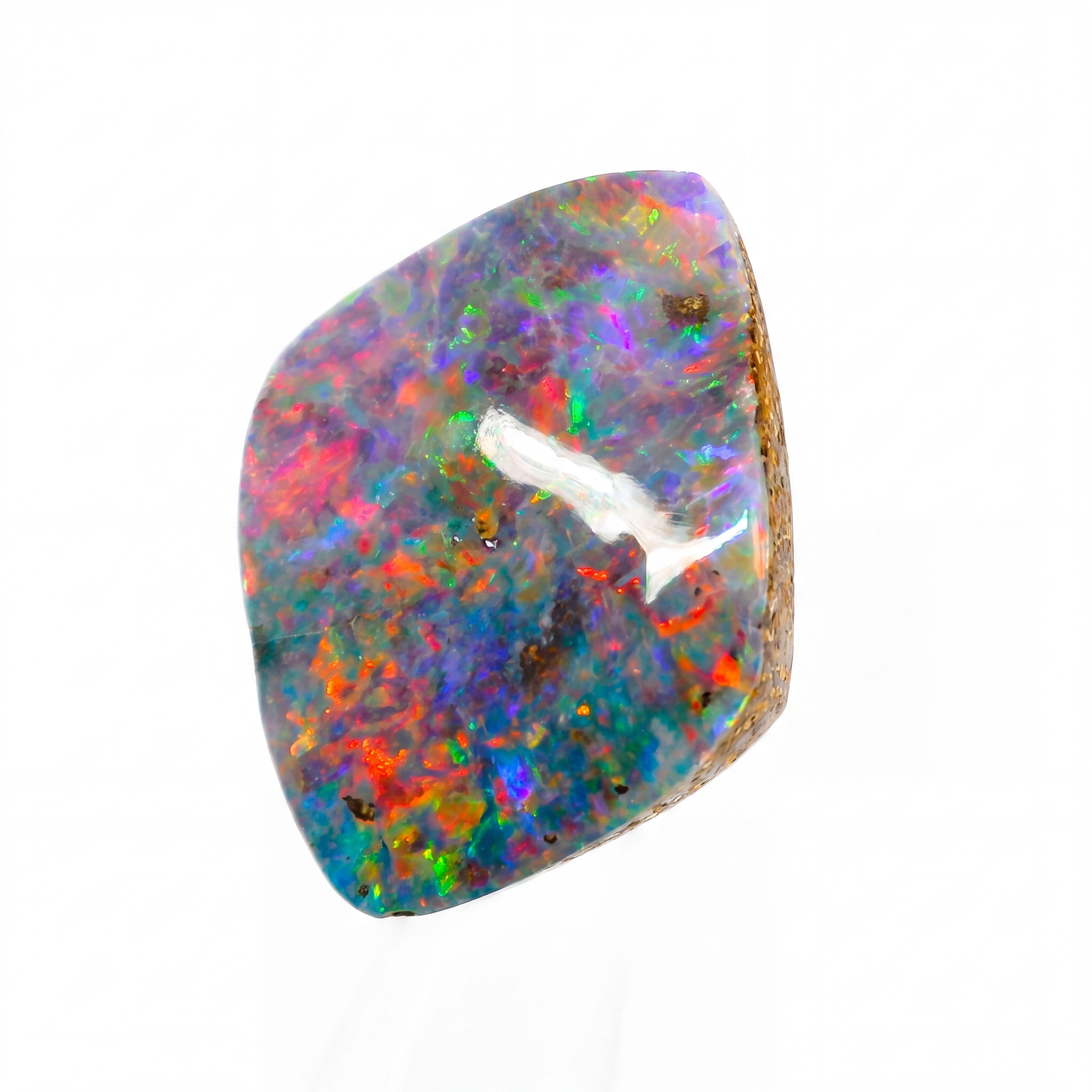 Multicoloured opal stone on a white background