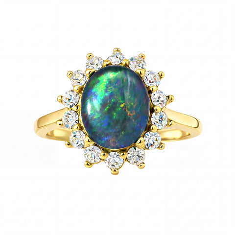 Gold ring with an opal stone and diamonds on a white background