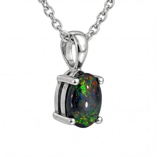 Opal pendant necklace with silver chain on a white background