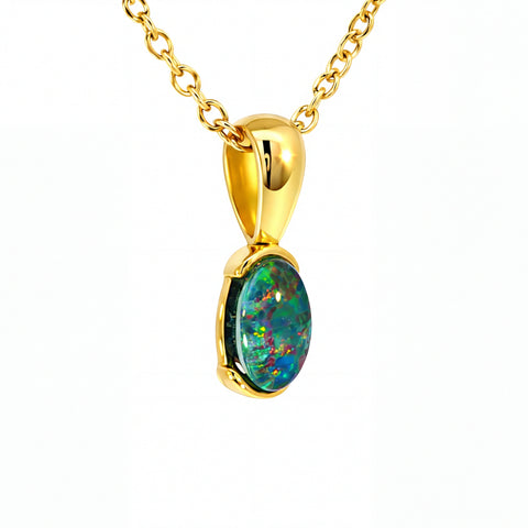Gold pendant with a colourful gemstone on a white background
