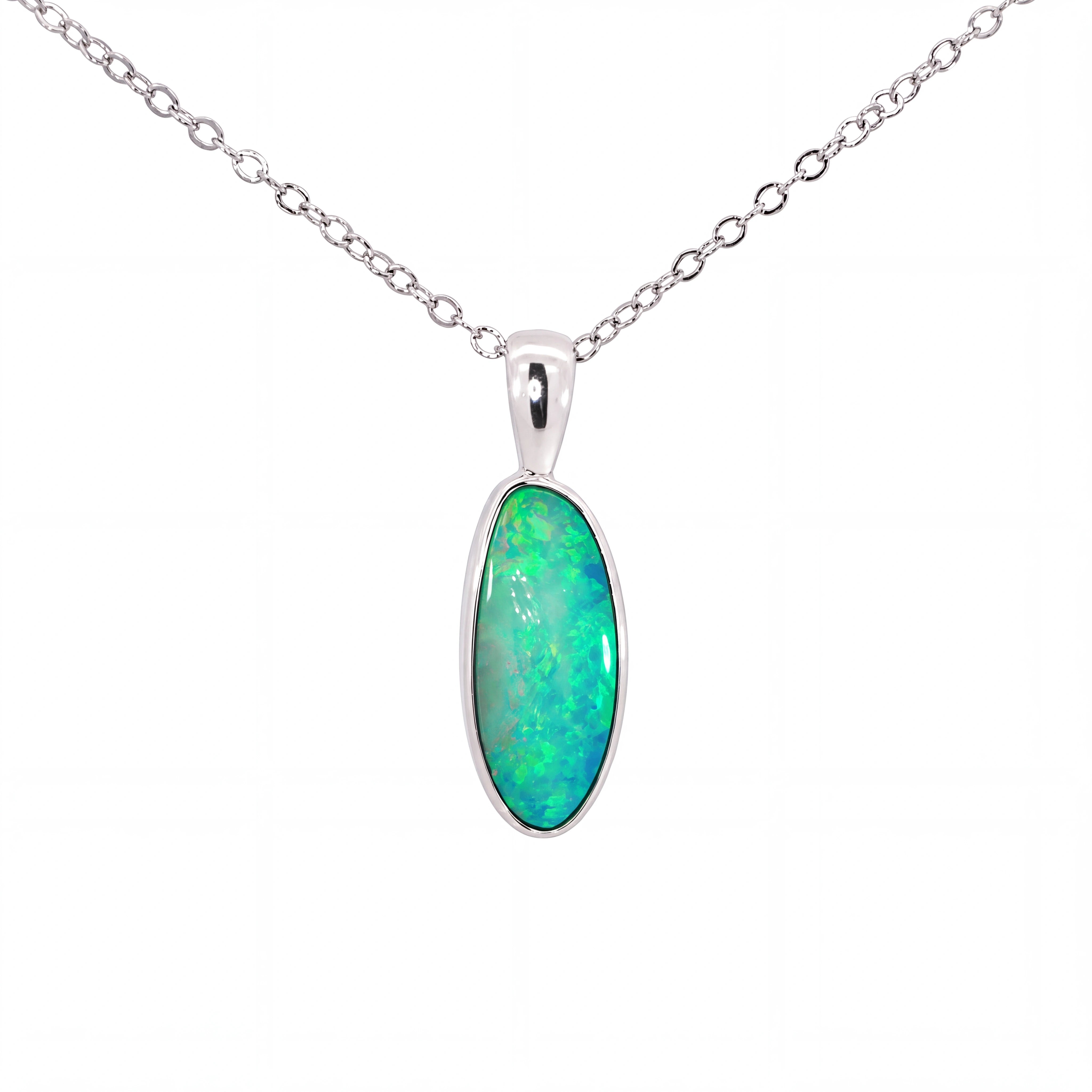 A silver chain necklace with an oval pendant featuring a vibrant green and blue opal stone, set in a polished silver bezel, on a plain white background.