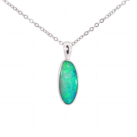 A silver chain necklace with an oval pendant featuring a vibrant green and blue opal stone, set in a polished silver bezel, on a plain white background.