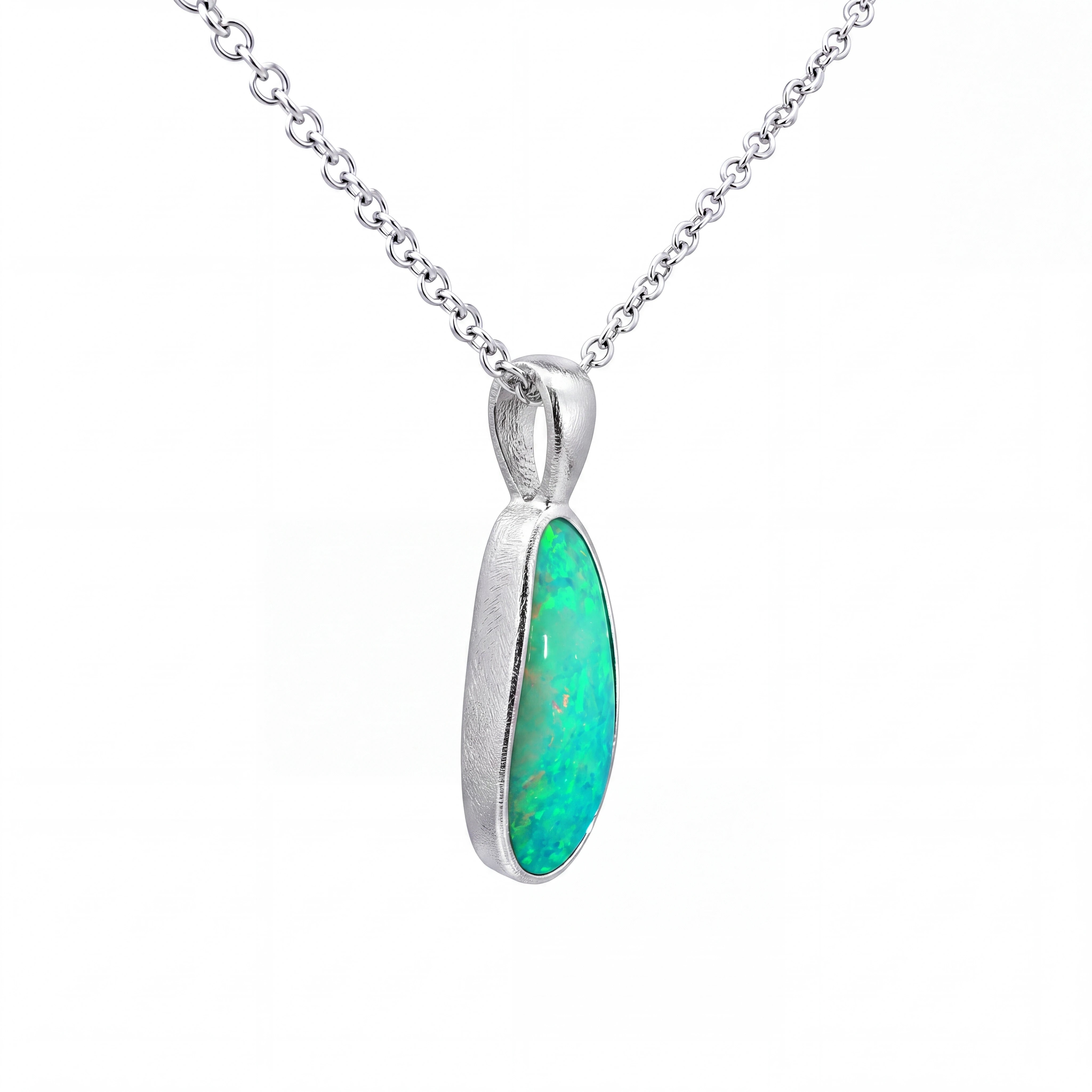 A silver chain necklace with a teardrop-shaped pendant featuring a vibrant green opal gemstone in a polished silver bezel setting, shown against a plain white background.