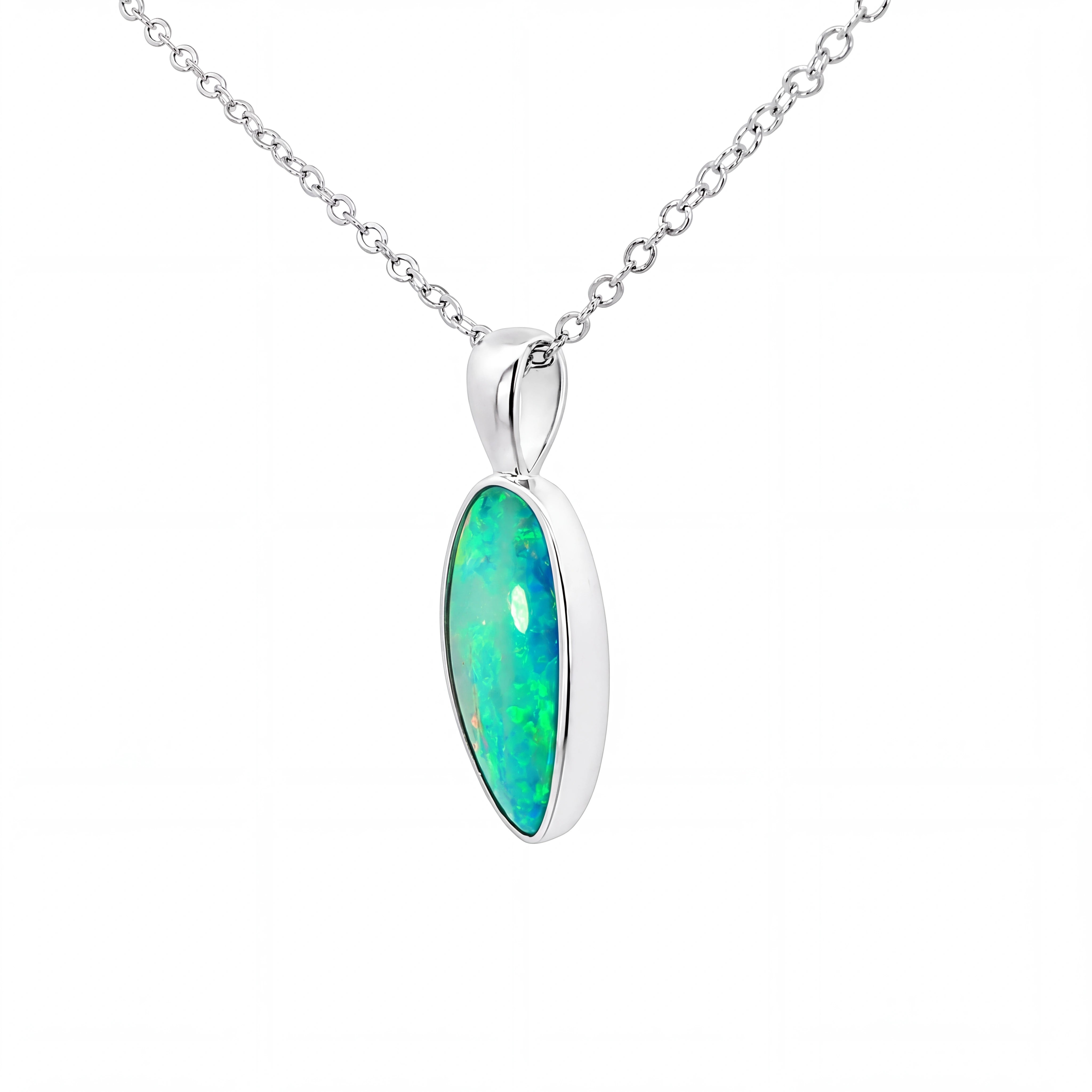 A silver chain necklace with an oval pendant featuring a vibrant green and blue iridescent opal stone set in a polished silver bezel, shown against a plain white background.