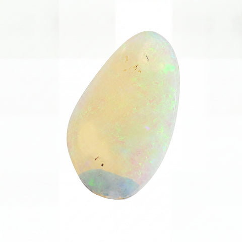 A polished teardrop-shaped cabochon opal gemstone with a creamy off-white base and vibrant iridescent flashes of green, blue, and pink, set against a plain white background.
