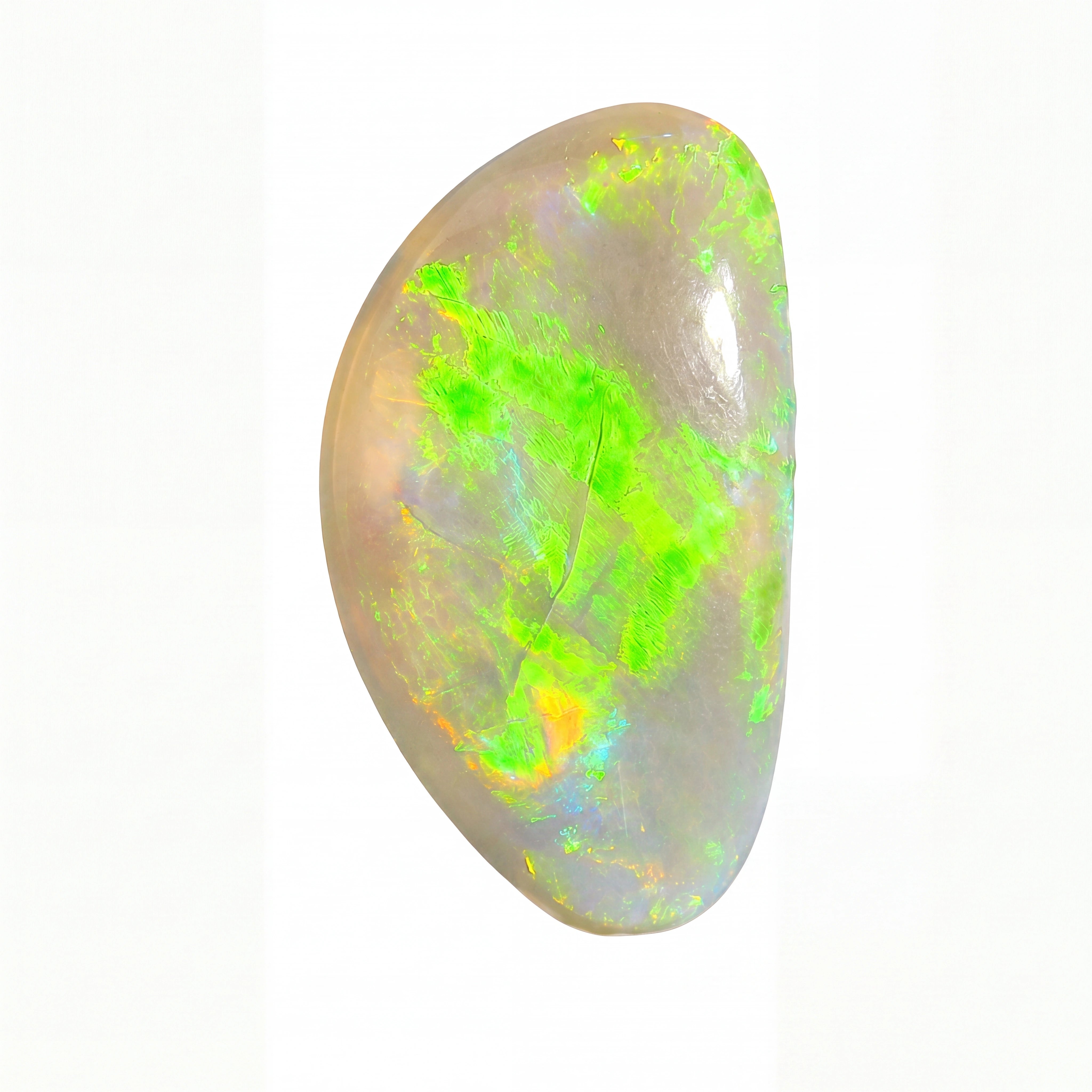 A polished opal gemstone with vibrant green, orange, and blue flashes on a pale greyish-white base, isolated on a white background.