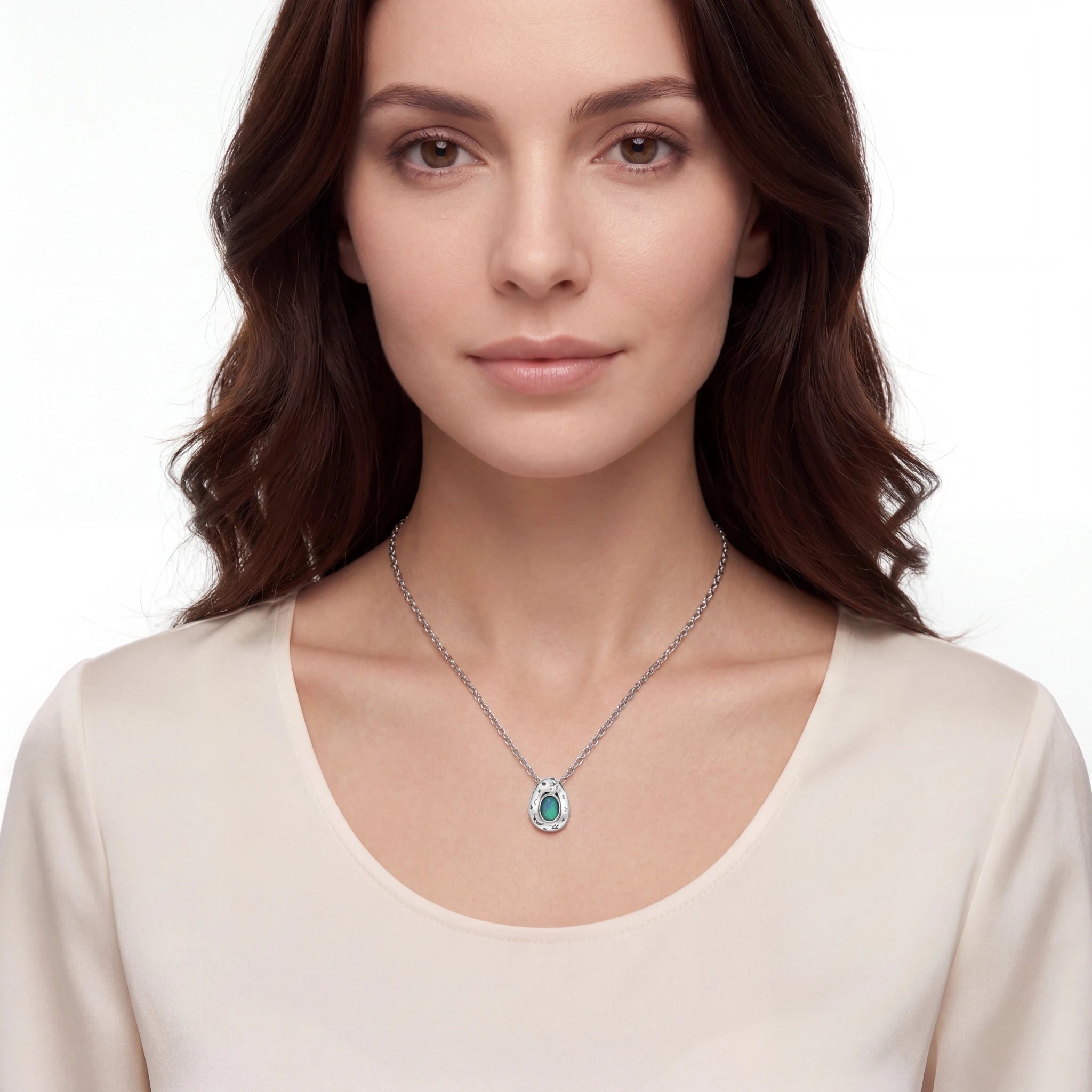 Woman wearing a necklace with a pendant on a white background