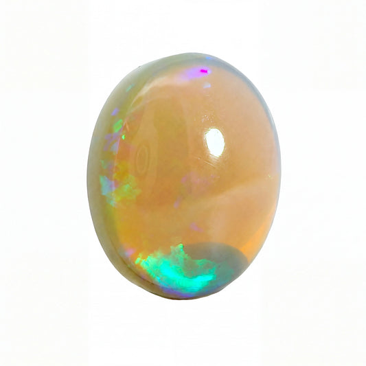 A polished oval cabochon gemstone with a peachy-orange body and vibrant iridescent flashes of green, blue, pink, and purple, isolated on a white background.