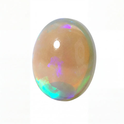 A polished oval cabochon gemstone showing a peachy-tan base with vibrant flashes of purple, green, and blue iridescence, set against a plain white background.