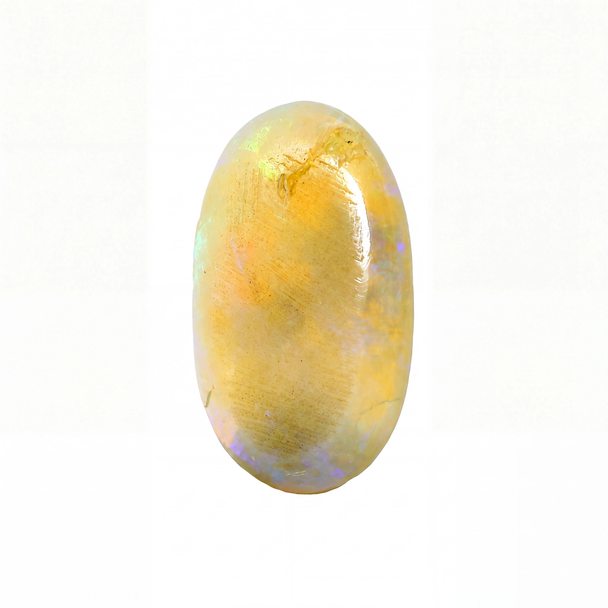 A polished oval cabochon gemstone with a dominant golden-yellow hue and subtle iridescent flashes of blue and green, set against a plain white background.