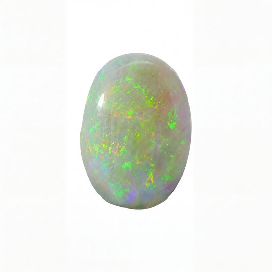 A polished oval cabochon opal gemstone displaying vibrant flashes of green, yellow, and blue iridescence against a pale grеyish-white base, isolated on a solid white background.