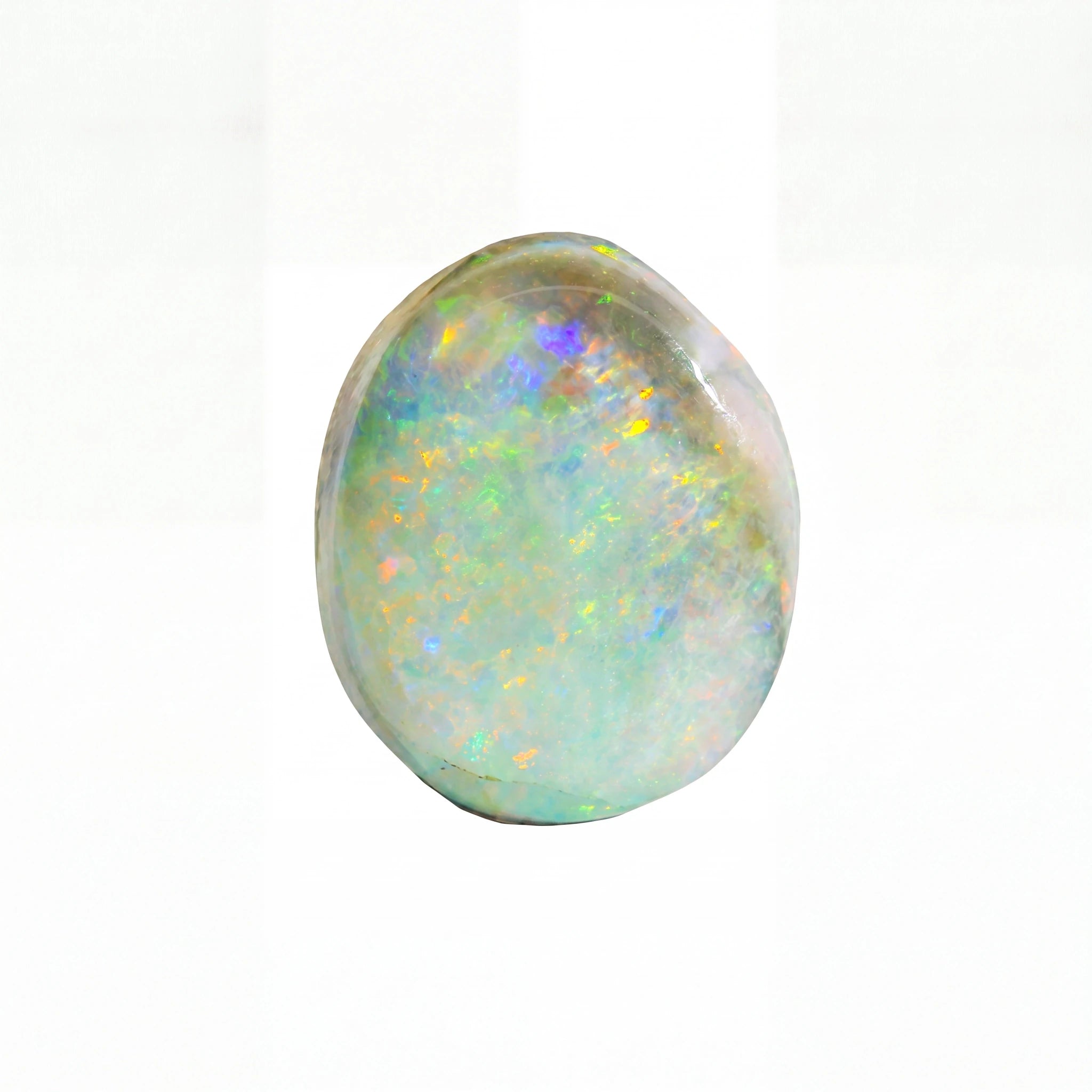 A polished cabochon opal gemstone displaying a soft, pearlescent body with shifting iridescent flashes of blue, green, yellow, and purple on a white background.