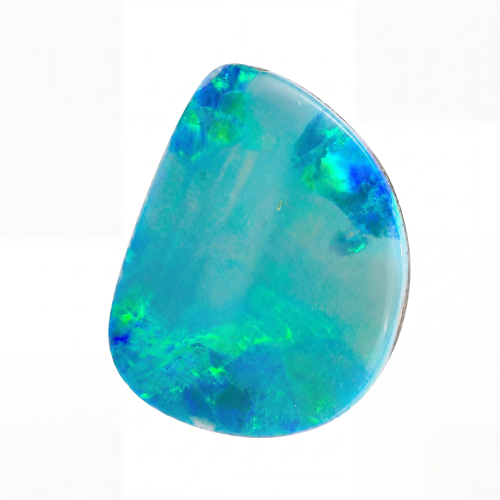 Teardrop-shaped opal stone with vibrant blue and green colours on a white background