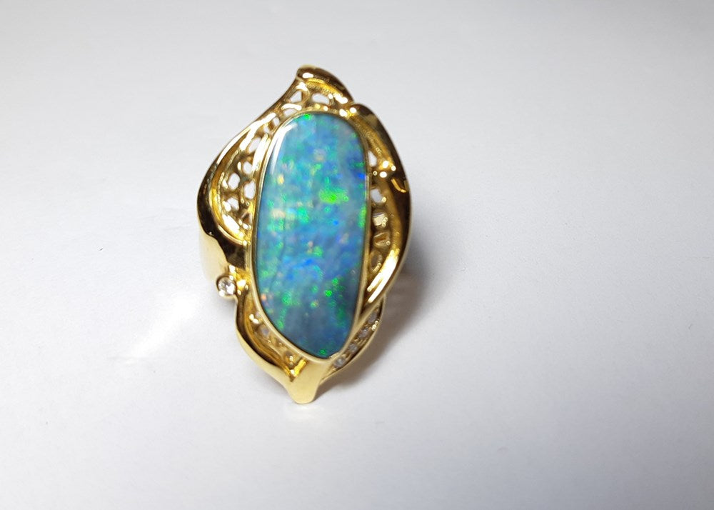 Boulder Opal 6.00 Carats  Ring set in 18 K Yellow Gold with 5x G-H/Vvs-Si1 Diamonds TW 0.400 Carats