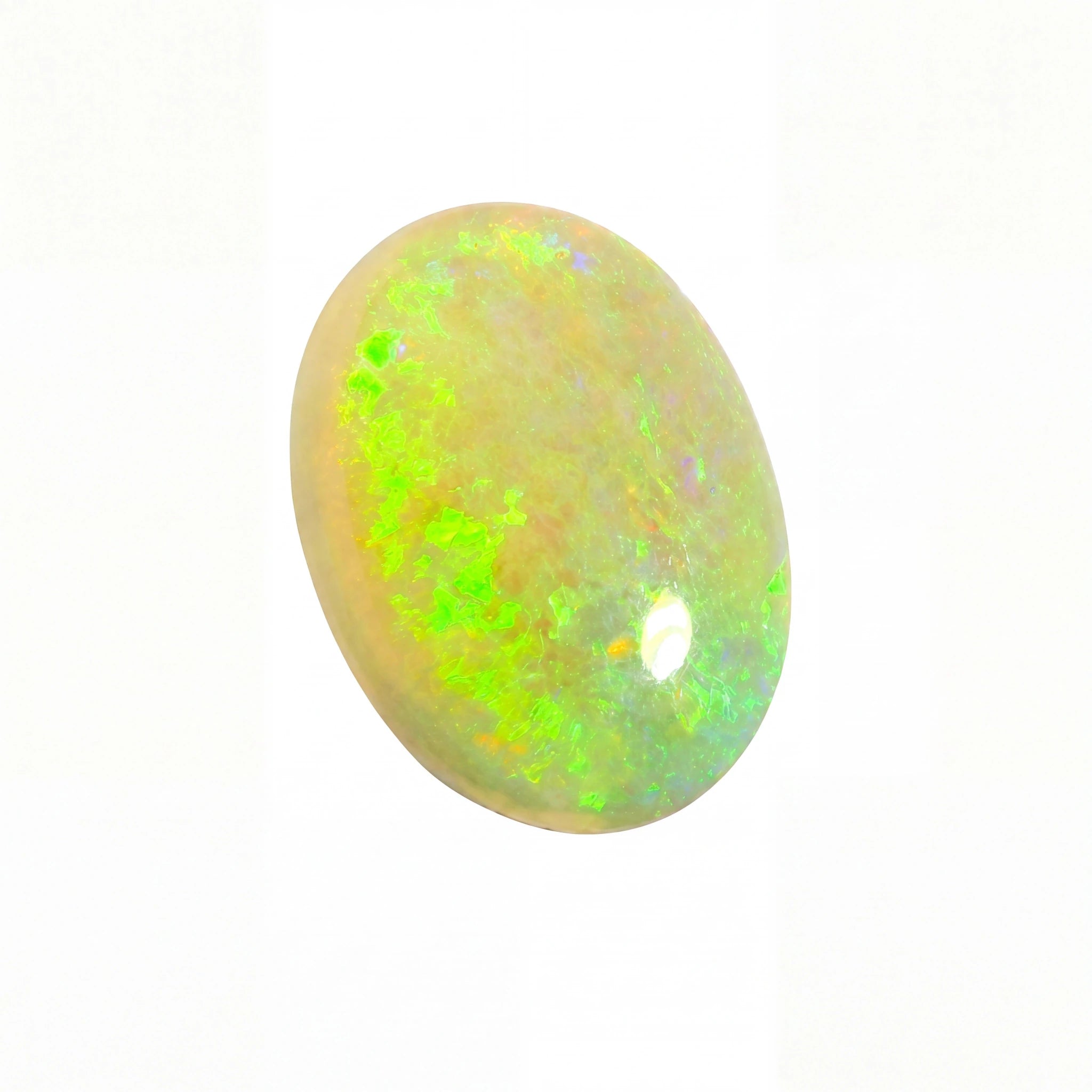 Opal stone with green and yellow fluorescence on a white background