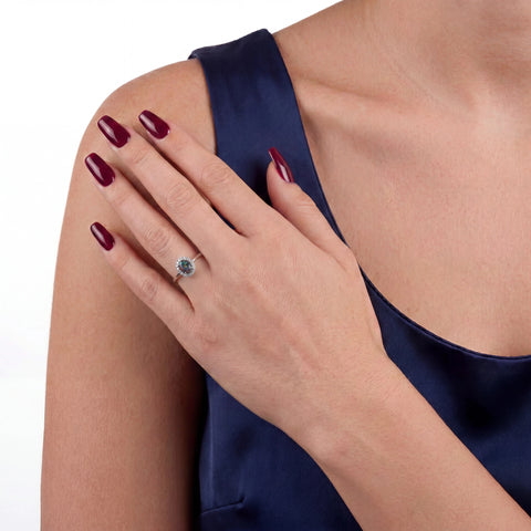 Close-up of a woman wearing an opal ring