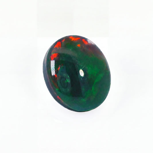 Green and red opal stone on a white background