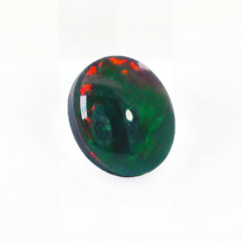 Green and red opal stone on a white background