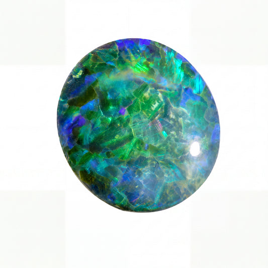 Round opal stone with green and blue colours on a white background
